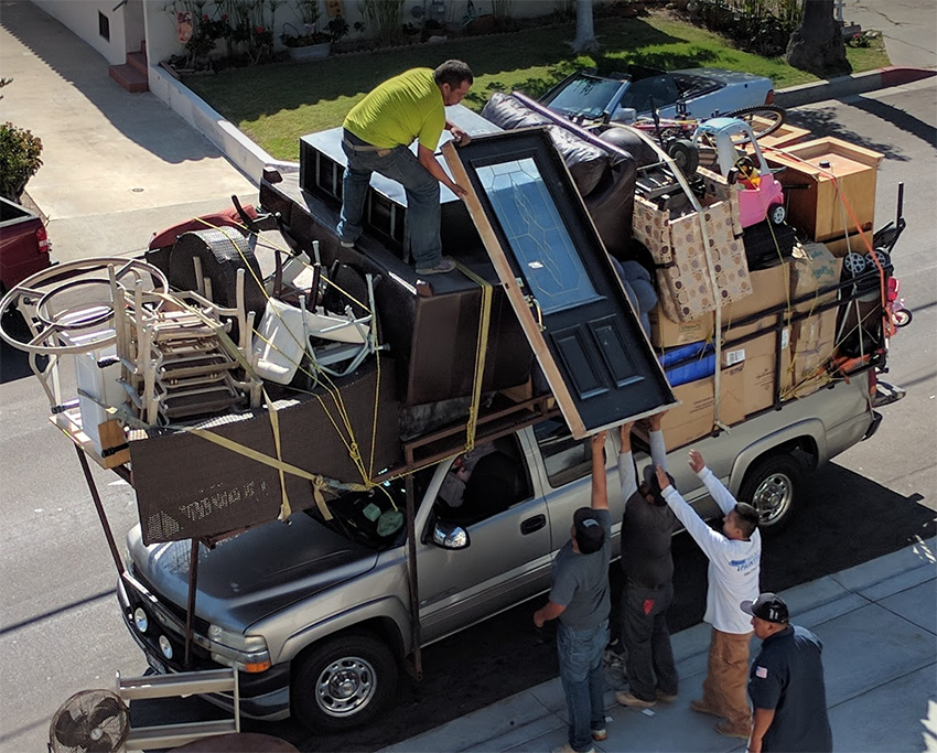 Chevrolet 2500 being loaded with too much furniture with more to load onboard. Check your load weights with Gold Coast Mobile Weigh in Queensland.