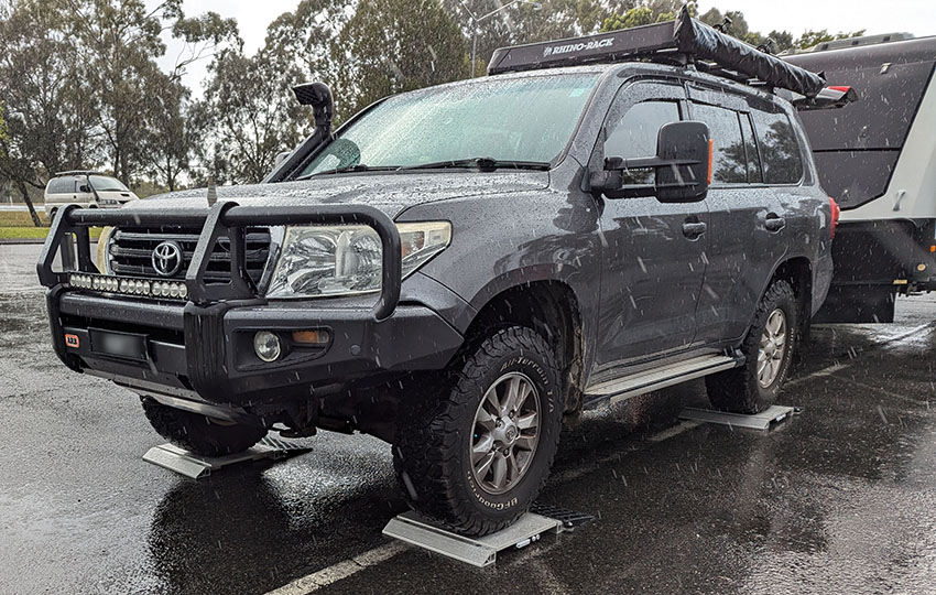 A photo of a Toyota Landcruiser 300 series on weighing scales in Jabiru Island, Hope Island - Hollywell Qld
